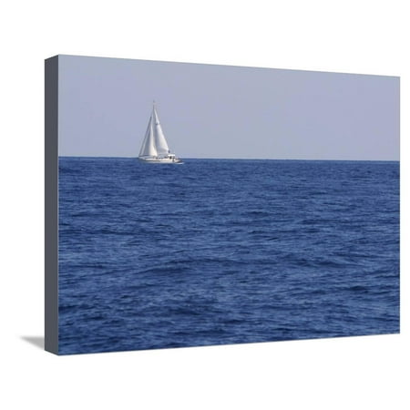 An Expanse of Blue Sea with a Single White Sailboat Stretched Canvas Print Wall