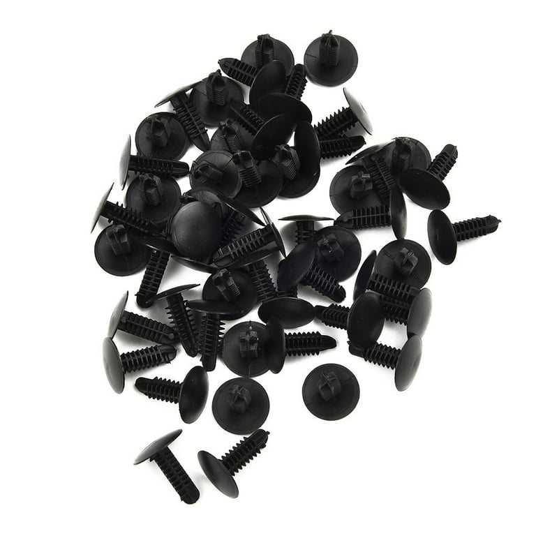 Macro shot plastic black clips for the car. Panel plastic rivets
