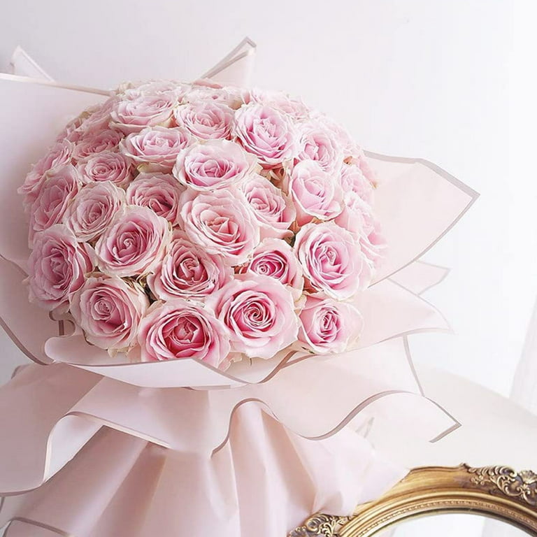 Premium Photo  Bouquet of soft pink flowers in pink wrapping