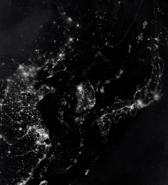 Satellite view of the Korean Peninsula showing city lights at night Poster Print by Stocktrek
