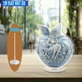 thumbnail image 4 of A rotating acrylic ornament featuring a blue and white porcelain apple with an elegant elf amidst roses symbolizing temptation on a crystal clear background, 4 of 6