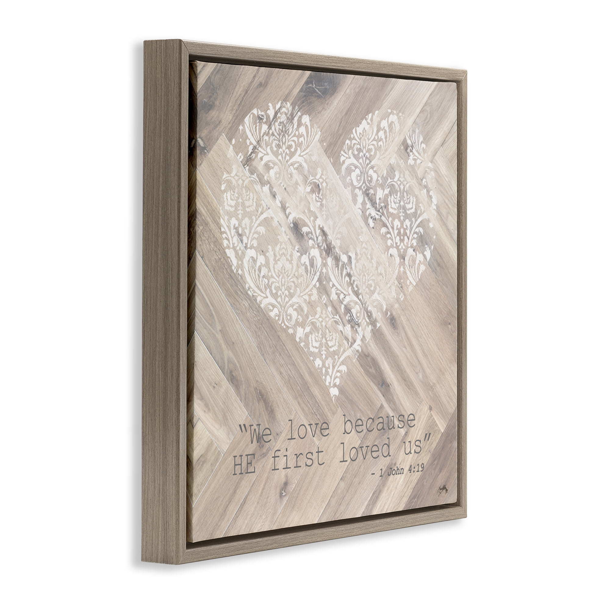 Stupell Industries He Loved Us First Brown Framed Floater Canvas Wall Art, design by Elizabeth Medley