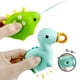 thumbnail image 3 of Juguete flotante de dinosaurio de goma suave para bañarse en el agua, con cuchara para chorros (1 juego), 3 of 5