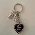 thumbnail image 1 of Charming Keychain: Features a Shiny Silver Heart and a Sweet Bow Detail, 1 of 9