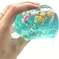 thumbnail image 1 of Juguete antiestrés de goma azul con lentejuelas de estrellas y conchas | Juguete antiestrés de 4,5 cm para apretar y descomprimir | Adorno curativo de escritorio y regalo para desahogarse, 1 of 5
