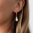 thumbnail image 3 of Gem Stone King 18K Rose Gold Plated Silver White Opal and White Lab Grown Diamond Dangle Earrings for Women (2.53 Cttw, Oval Cabochon 9X7MM), 3 of 3