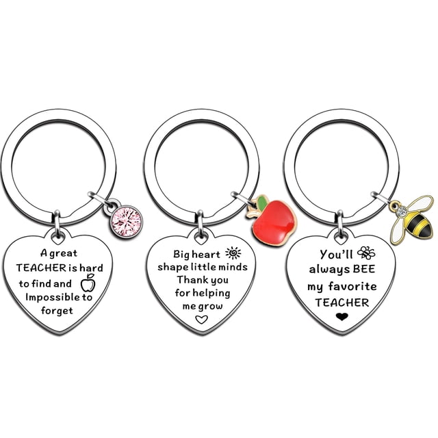 regalos de agradecimiento para maestros para mujeres regalos de agradecimiento regalo de agradecimiento para maestros (3 pcs) Conjunto frontal de 3 llaveros de acero inoxidable color blanco con colgantes en corazón grabados; uno con dije de cristal rosado y texto en inglés, uno con manzana roja esmaltada y mensaje de gratitud, y uno con abeja esmalatada amarillo/negro y texto 'You'll always BEE my favorite TEACHER'. Anillas circulares y acabado pulido visibles sobre fondo neutro; suelen usarse también como recuerdo de profesor.