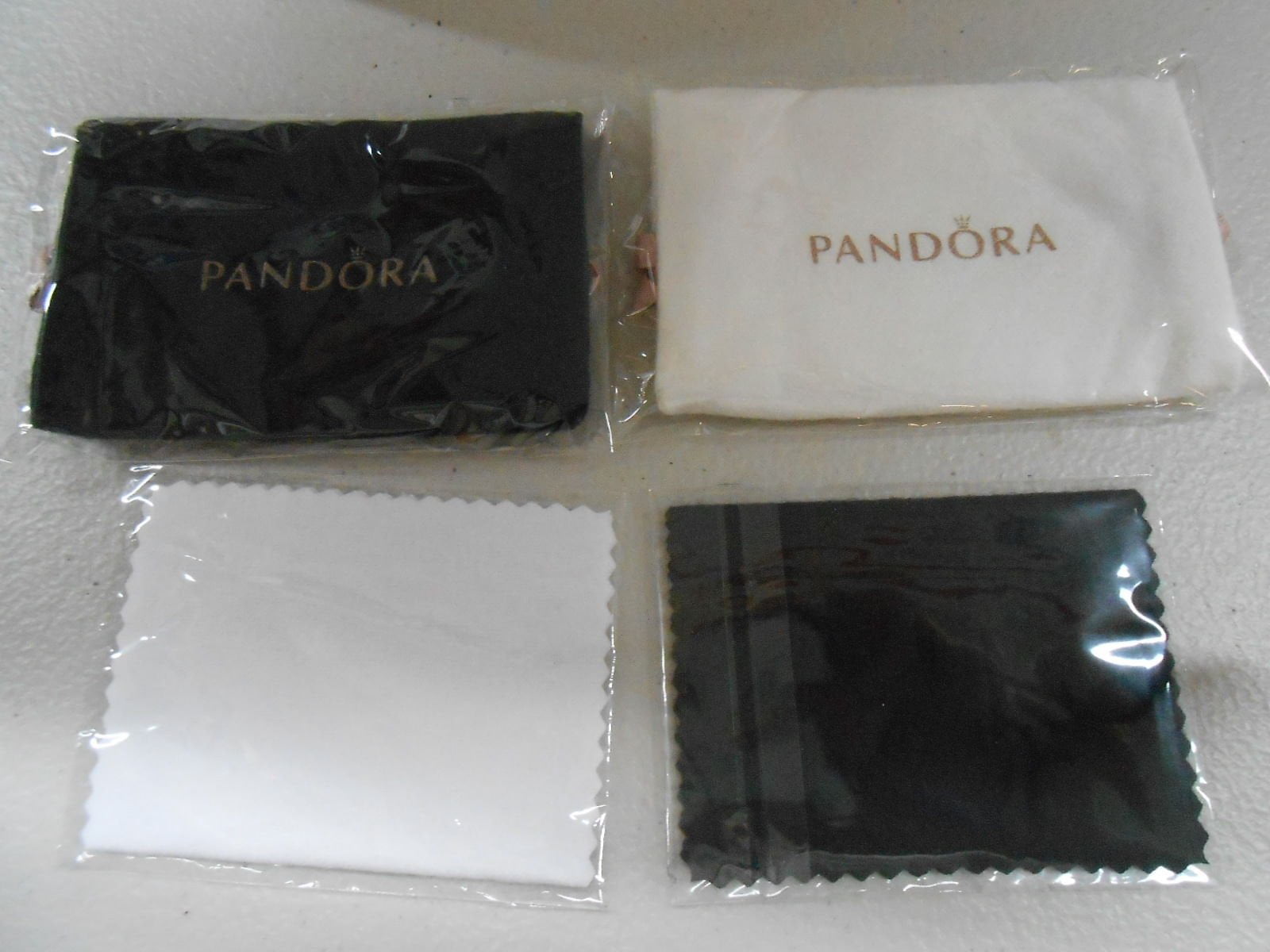 LOT:419  Pandora cleaning kit, with key ring and brush, two silver