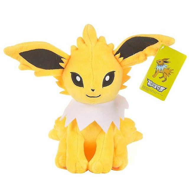 peluche baculerty: varios tipos de pokémon figura de peluche, vista frontal centrada de un muñeco amarillo sentado con orejas largas con interior negro, cuello blanco festoneado en tela, ojos y boca bordados y etiqueta colgante visible sobre fondo blanco de estudio; fotos reales, tamaño puede variar según medición manual.