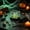 Green, variant on PLPPYFS Halloween Mini Crystal Skull Desktop Ornament, Natural‑Stone‑Style Skull Figurine in Clear Display Box with Moss Base for Halloween Party, Shelf, Cabinet, Home Holiday Decoration