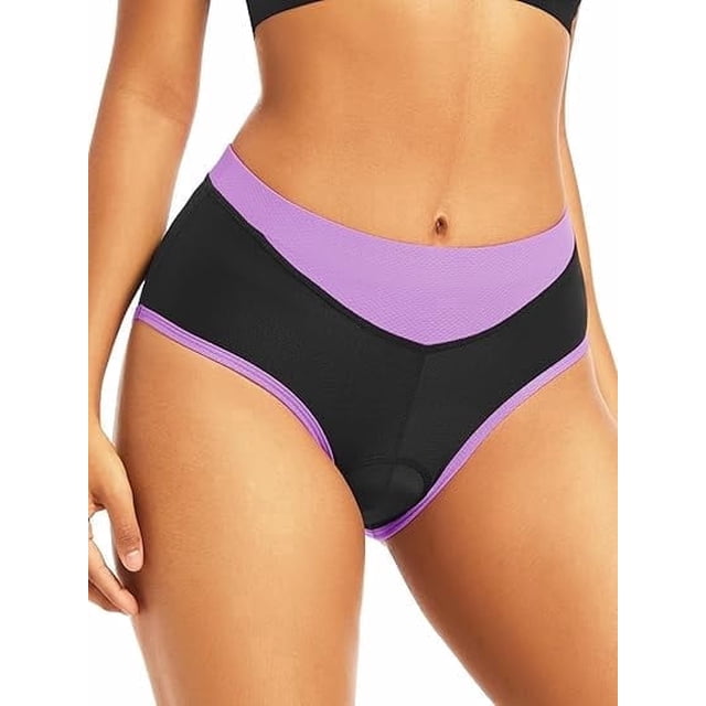 qualidyne ropa interior de bicicleta acolchada 4d para mujer, shorts con forro transpirable para ciclismo de carretera y montaña — Frontales ajustados en púrpura y negro; shorts tipo liner de tela elástica (90% poliéster, 10% elastano) con paneles de malla en la pretina y laterales, costuras planas visibles y gamuza acolchada con gel en la entrepierna; modelo muestra el ajuste como capa base bajo ropa exterior, suitable para ciclismo y viajes cortos en bicicleta.