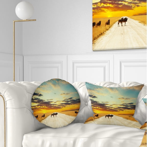 Designart Wildebeests Crossing Path in Evening - African Landscape Printed Throw Pillow - 12x20