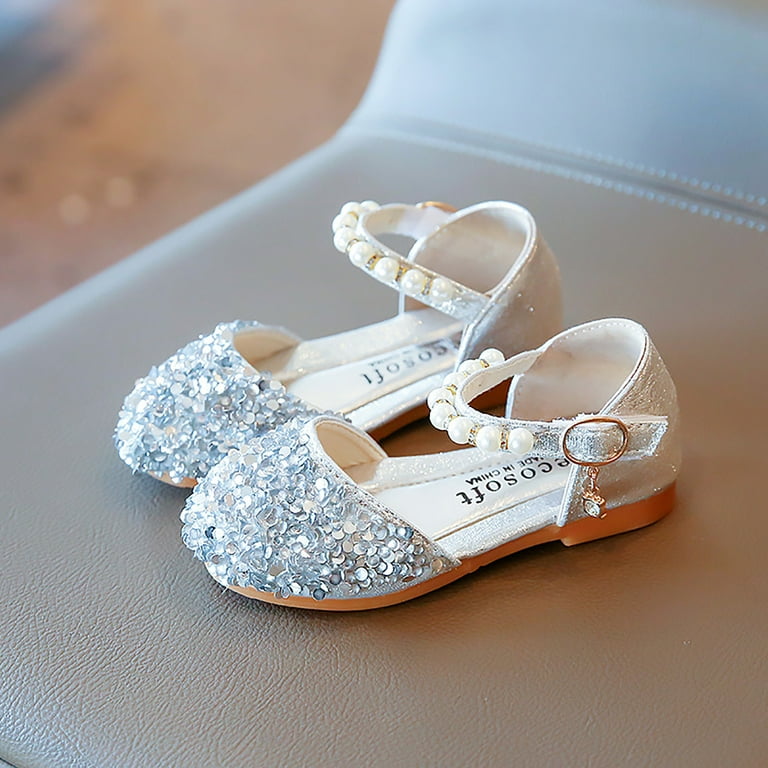 Baby girl shops bling shoes