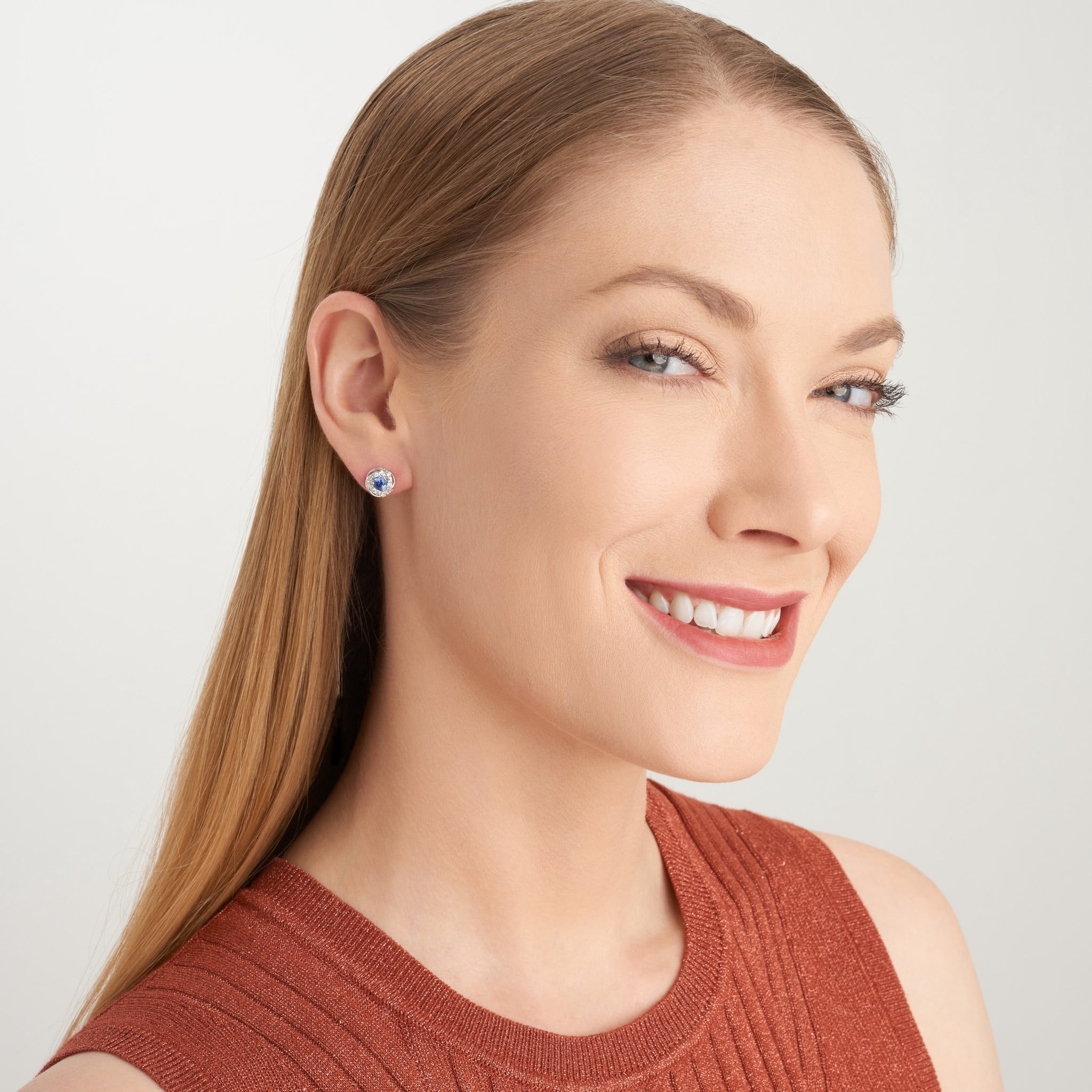 Forever Facets Jewelry Platinum Over Sterling Silver 1/8th Carat Total Weight Lab Grown Diamond and Created Blue Sapphire Delicate Knot Stud Earrings