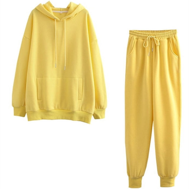 Women Solid Color Sets Hood Wear Lounge Wear Suit Sport Set Tops+Pants in a vibrant yellow color. This women's sweatshirt and pants set includes a long-sleeve hoodie with a front pocket and drawstring detail, paired with matching elastic-waist pants featuring side pockets. Made from a polyester blend, this casual and lightweight lounge set is ideal for daily wear, lounging, or outdoor activities.