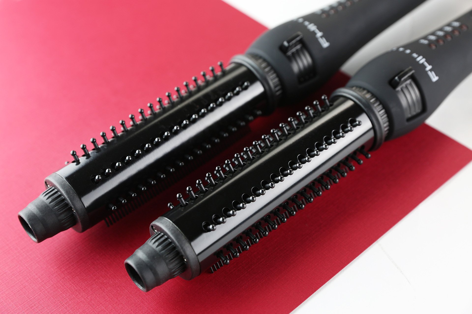 tangle free curling iron with retractable bristles