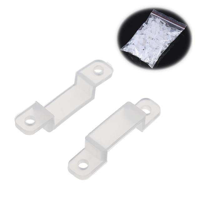 clips de sujeción translúcidos fijador de montaje flexible para fijar la tira de led tfixol clips de luz de tira, pack de 100 piezas en plástico PU; primer plano de dos clips con pestaña central elevada y orificios para tornillo, diseño para tiras LED de 8–12 mm y bolsa con piezas en miniatura, a menudo usados también para sujetar cables finos en muebles o automóviles.