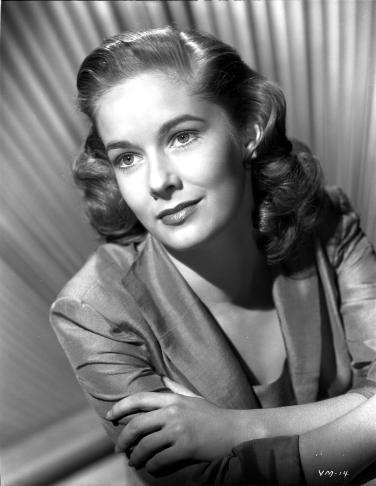 Vera Miles pictured in portrait with arms crossed weraing a quartered