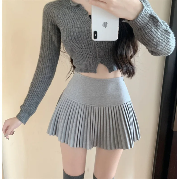 Falda corta estilo americano de talle alto que adelgaza la línea A para mujer, nueva falda de lana plisada blanca para desplazamientos diarios otoño/invierno