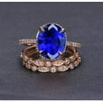 thumbnail image 1 of 2.75 Carat Blue Sapphire 8x6mm Oval Cut And Moissanite Diamond Halo Trio Wedding Ring Bridal Set in 10k Rose Gold, 1 of 4