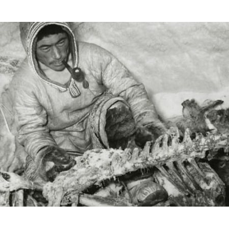 Mid adult Eskimo man holding the bone of a caribou Canvas Art -  (24 x