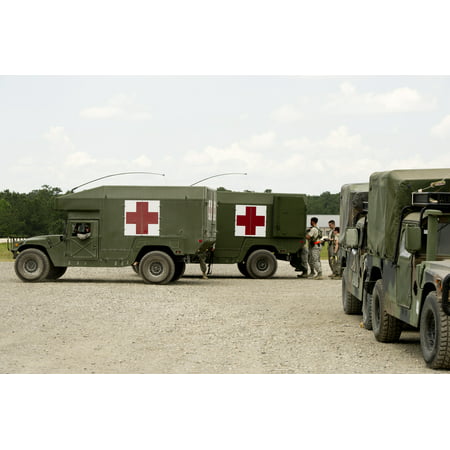LAMINATED POSTER U.S. Army M997 High Mobility Multi-Purpose Wheeled Vehicle Ambulances sit in front of the Mobile Aer Poster Print 24 x