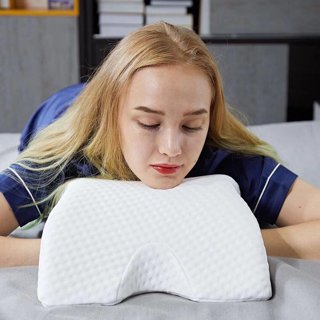 Pillow with clearance arm hole