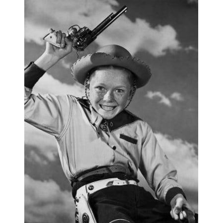 Boy in cowboy costume holding toy gun Stretched Canvas -  (24 x