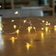 thumbnail image 2 of Guirnalda de luces LED de 50 LED, guirnalda de luces decorativas alimentadas por batería, alambre de cobre para dormitorio, boda (16 pies/5 m, blanco cálido) Ormromra SNFLD382, 2 of 8