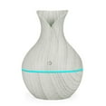 thumbnail image 1 of Xihbxyly Difusor de Aceite Led, Humidificador de Aromaterapia, 7 Luces Que Cambian de Color, Funcionamiento Silencioso, Ideal para Dormitorio, Oficina, Spa, Capacidad de 130 Ml, Diseño de Veta de Mad, 1 of 4