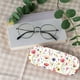 thumbnail image 5 of Estuche rígido para gafas con diseño de flores, de cuero, para gafas de sol, delgado, portátil, con tapa tipo almeja, funda protectora, funda con paño de limpieza., 5 of 9