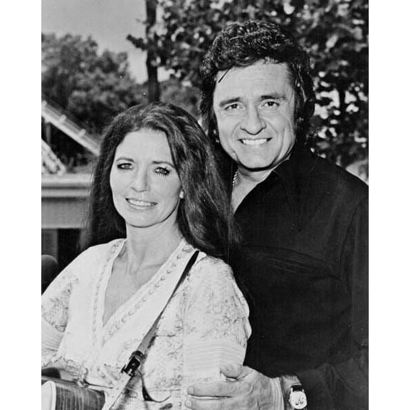 Johnny Cash poses with June Carter Cash with guitar 1978 Poster 16x20 inches