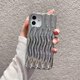 thumbnail image 4 of Funda para iPhone con diseño de ondas 3D y bordes rizados, de silicona suave, fina, a prueba de golpes (plateada brillante, iPhone 12/12 Pro), 4 of 8