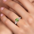 thumbnail image 4 of Gem Stone King 925 Sterling Silver Green Peridot and White Lab Grown Diamond 3 Stone Engagement Ring for Women | 1.50 Cttw | Oval 8X6MM | Round 2MM | Gemstone August Birthstone | Size 8, 4 of 6