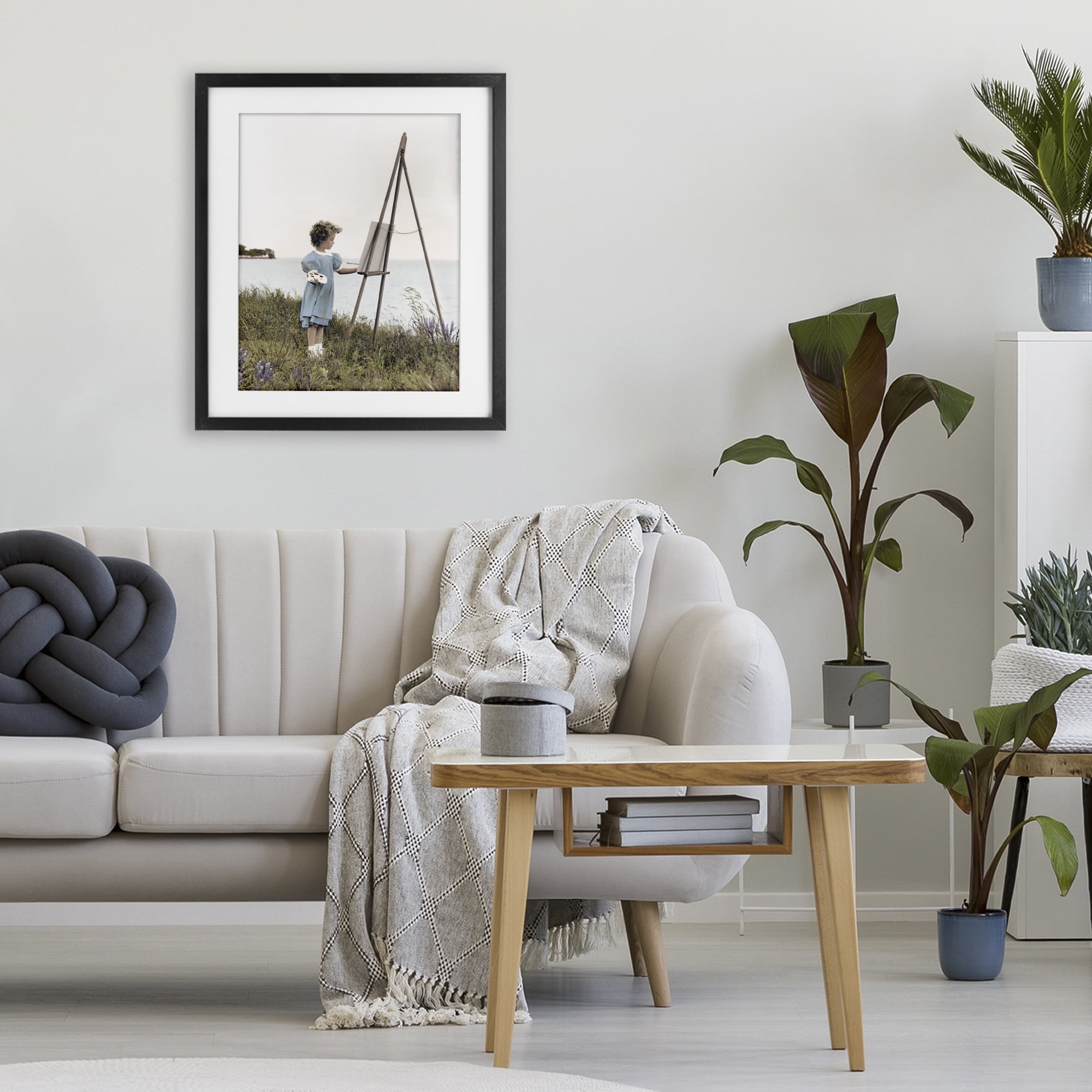 Stupell Industries Child Painting on Easel Black Framed Print Under Glass, design by Kendra Dew