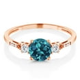 thumbnail image 3 of Gem Stone King 10K Rose Gold London Blue Topaz White Created Sapphire and White Diamond Accent 3-Stone Engagement Ring for Women (0.89 Cttw, Round 6MM, Gemstone November Birthstone, Size 5), 3 of 6