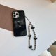 thumbnail image 3 of Funda de mariposa negra brillante compatible con iPhone 14, bonita funda de mariposa negra 3D con soporte de mariposa y cadena de cuentas de corazón blanco y negro para mujeres y niñas., 3 of 8