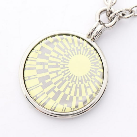 Pre-Owned Hermes Hermès OP'H medal necklace in stainless steel for women silver and yellow.