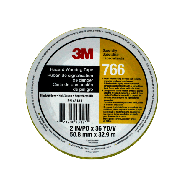 cinta de marcaje 3m 50mm x 33m negro/amarillo Rollo visto cenital de cinta de vinil bicolor negro y amarillo con etiqueta central 3M 766 y textos de advertencia en inglés/español; ancho 50 mm, largo 33 m, soporte PVC con adhesivo de caucho para fijación instantánea; a menudo usada para delimitar áreas, pasillos o zonas de trabajo.
