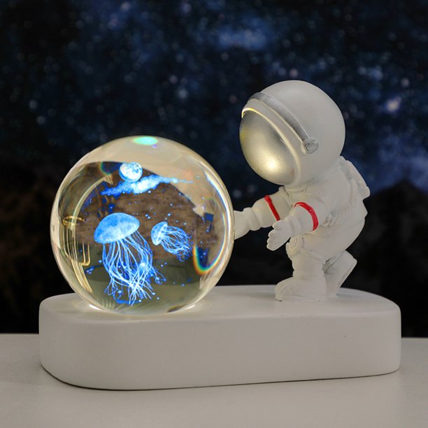 Bola de cristal tallada con luz de noche con forma de astronauta y base luminosa para estudiantes y amigos