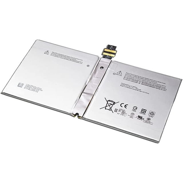Replacement Battery G3HTA027H compatible with Microsoft Surface Pro 4 1724. The battery features a flat, rectangular design with a metallic finish and visible connector pins at the top. It includes printed safety and certification markings on the surface. Suitable for Microsoft Surface Pro 4 1724 devices, it is recommended to seek professional assistance for installation.
