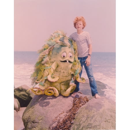 Sigmund and the Sea Monster Standing on A Rock in the Sea with the Sea Monster in A Movie Scene Photo