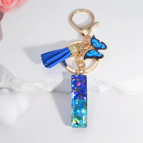 LLavero de lentejuelas con 26 iniciales de la A la Z para hombre y mujer, accesorio de mano con borla de mariposa, Color Azul Marino