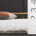 thumbnail image 2 of SAFAVIEH Rumi Beumont Solid Polyester Shag Area Rug, Ivory/Light Beige, 6'7" x 6'7" Round, 2 of 5