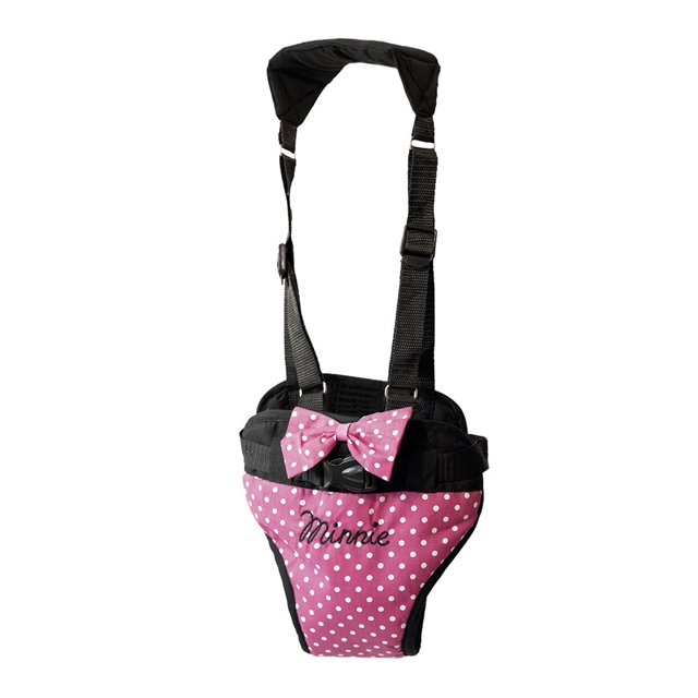 caminador minnie chiqui mundo minnie ajustable arnés para bebé color Minnie con panel frontal rosa de lunares blancos, lazo y bordado 'Minnie', tirantes negros ajustables y soporte para cintura; para 9 a 18 meses, lavable en casa, hecho en México.