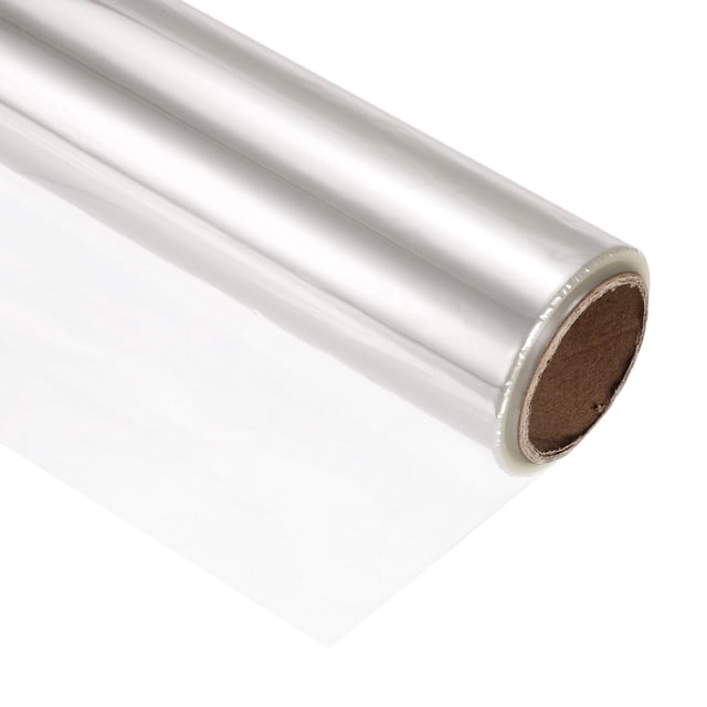Unique Bargains 98ft x 16in cellophane wrap roll made of OPP film, shown in a transparent finish. The roll is 2.2 mil thick, lightweight, and features high tensile strength and good transparency. Ideal for wrapping gift baskets, bouquets, and arts and crafts. The smooth surface and waterproof design enhance the freshness of flowers and provide a polished look for gifts. Suitable for occasions like Valentine's Day, Christmas, and Mother's Day.
