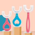 thumbnail image 1 of Cepillos de Dientes en Forma de U Sincero para Niños Cerdas de Silicona Masaje de Encías 2 a 12 Años, 1 of 5