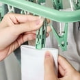 thumbnail image 5 of WarmHaven Clothes Drying Hanger with 32 Clips and Drip Foldable Hanging Rack (Light Green), 5 of 14