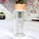 thumbnail image 3 of Vaso de agua portátil creativo de vidrio transparente con tapa de grano de madera y letras blancas de doble capa, 3 of 6