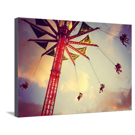 A Fair Ride Shot with a Long Exposure at Dusk Toned with a Retro Vintage Instagram Filter Stretched Canvas Print Wall Art By